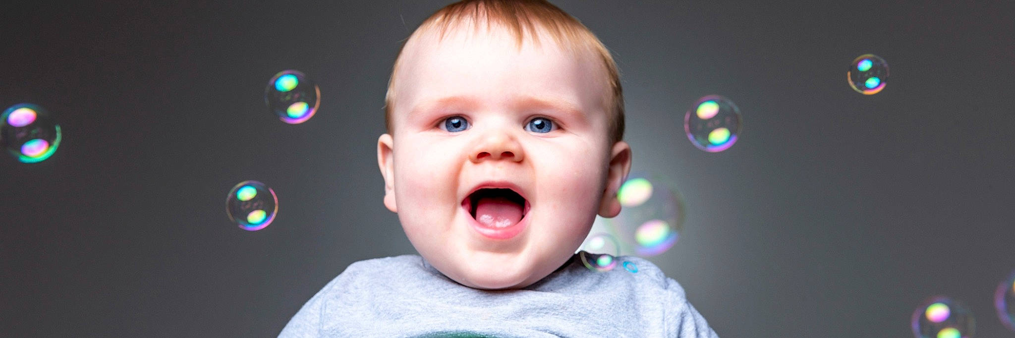 Tyler is registered to the contest to win money with this photo: baby, cheek, chin, ear, eye, eyelash, flash_photography, gesture, happy, human_body, iris, jaw, lip, mouth, nose, person, skin, smile, toddler, tongue