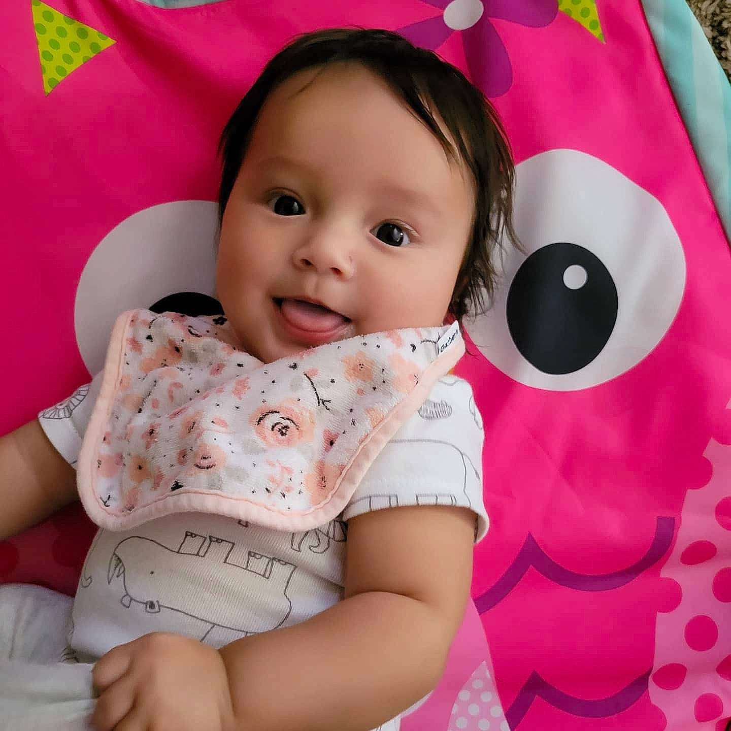 Amaris is registered to the contest to win money with this photo: baby, baby_toddler_clothing, cheek, child, collar, comfort, eyelash, happy, linens, lip, neck, pattern, person, pink, product, skin, sleeve, smile, t_shirt, textile