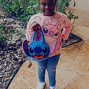 Azalea is registered to the contest to win money with this photo: clothing, face, footwear, head, herbal, herbs, jar, jeans, pants, path, person, photography, plant, planter, portrait, pottedplant, pottery, shoe, t_shirt, walkway