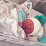 newborn, baby, blanket, hospital, bassinet, sleeping, hat, infant, swaddled, footprints, sign, pacifier, blue, pink, white, face, child, person, resting, newborn_baby