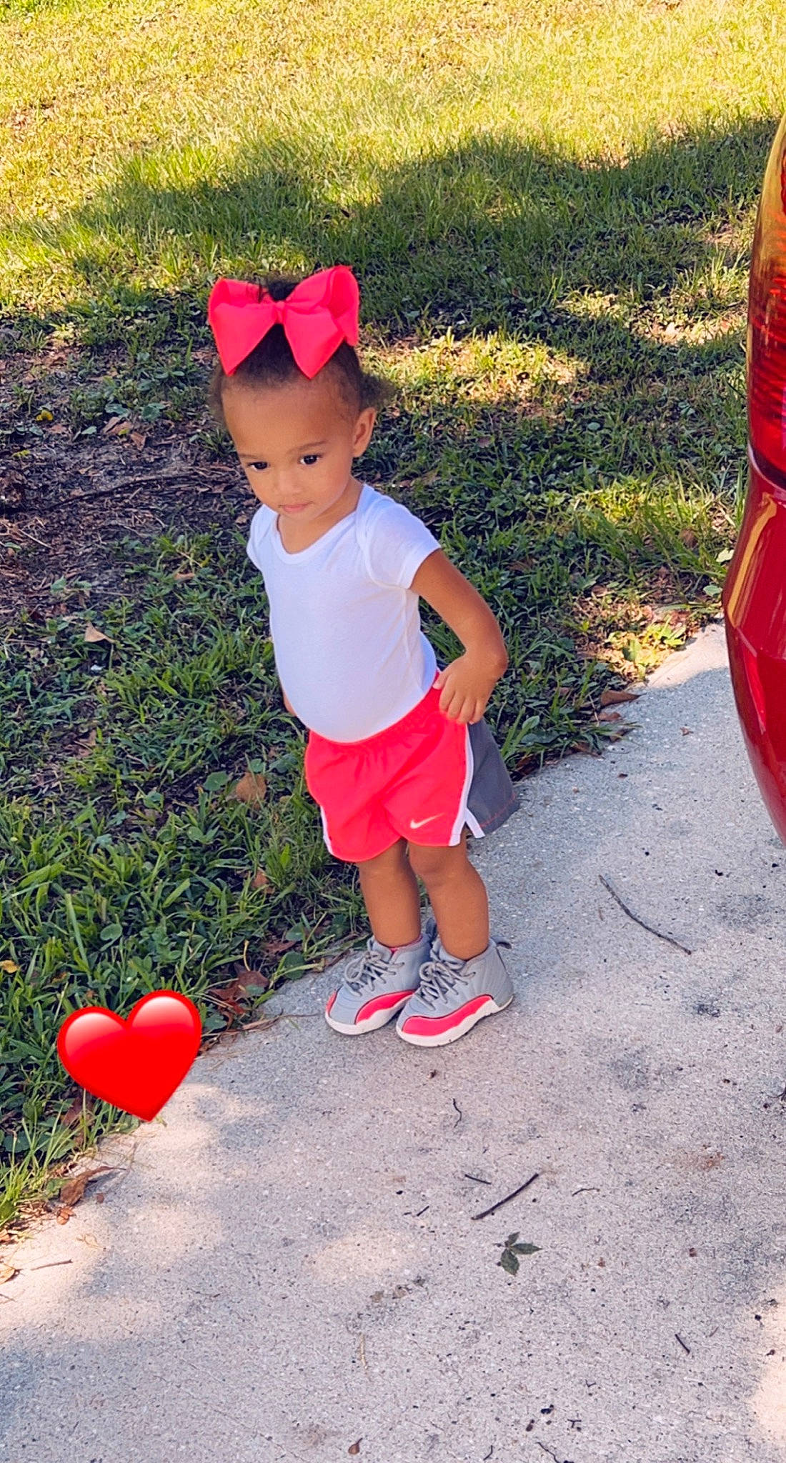 Kyleigh is registered to the contest to win money with this photo: baby_toddler_clothing, fun, grass, happy, leg, leisure, mammal, morning, orange, people, people_in_nature, person, pink, plant, red, shorts, summer, sunlight, t_shirt, toddler