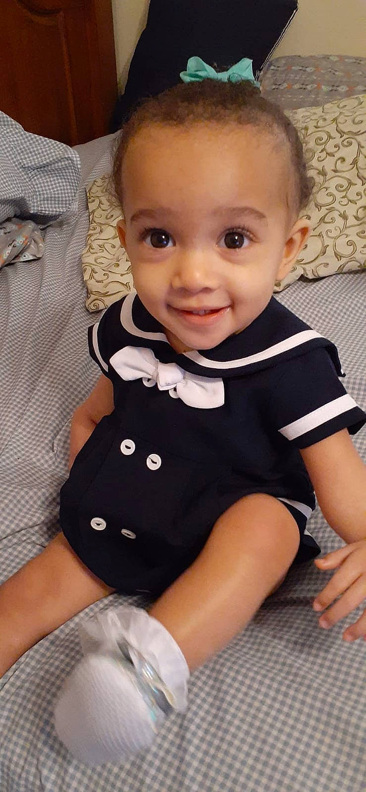 Kyleigh is registered to the contest to win money with this photo: baby, baby_products, baby_toddler_clothing, bow_tie, cheek, child, chin, collar, flooring, formal_wear, happy, joy, pattern, person, photo_shoot, sitting, skin, sleeve, smile, t_shirt