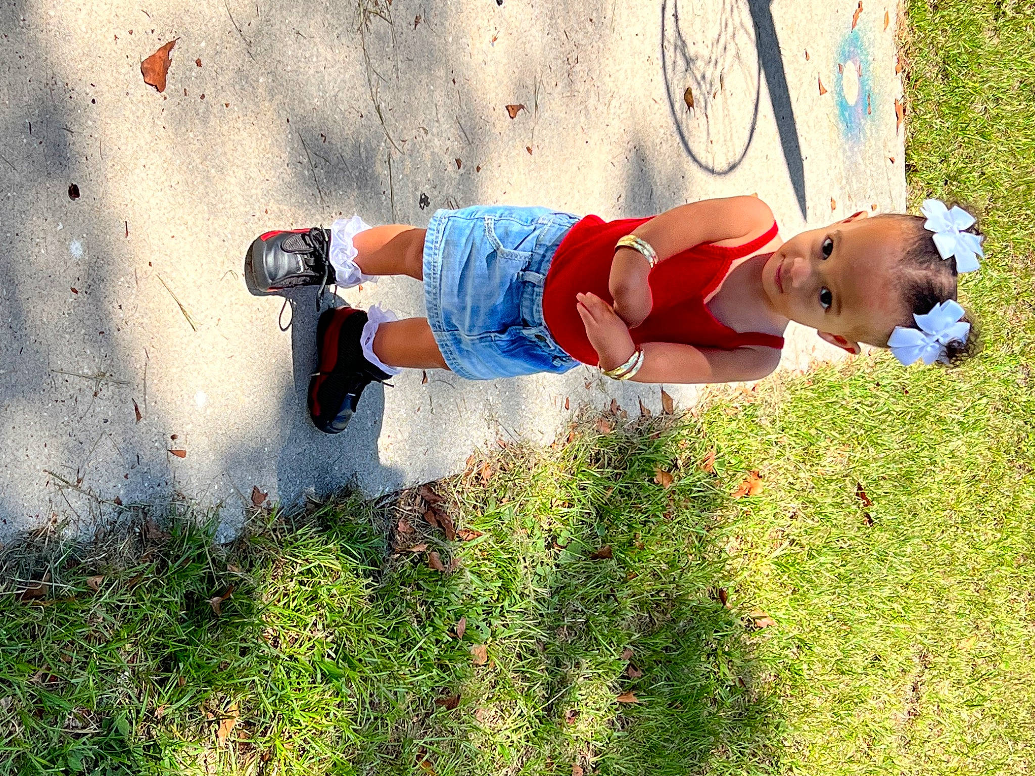 Kyleigh joined the competition — help win amazing prizes! baby, bicycle_wheel, child, fun, grass, grassland, happy, human_leg, knee, landscape, leisure, people_in_nature, person, plant, play, recreation, shadow, sitting, soil, summer