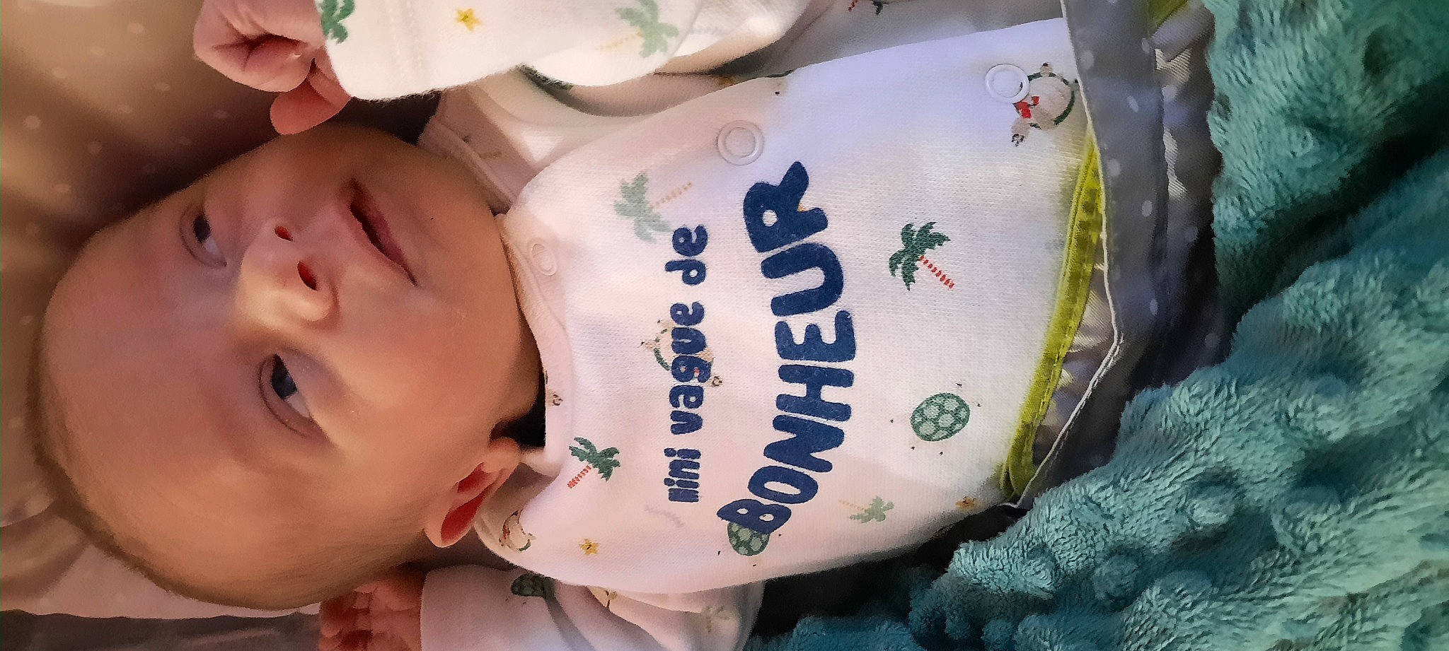 Gaspard participe au concours pour gagner de l'argent avec cette photo : baby, baby_toddler_clothing, cheek, child, comfort_food, drinkware, eyelash, face, font, happy, head, mammal, packaging_and_labeling, packing_materials, person, personal_protective_equipment, plastic, product, skin, sleeve