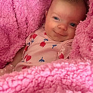 Hailey joined the competition — help win amazing prizes! baby, blanket, pink, smiling, face, infant, cute, cozy, clothing, fluffy, portrait, child, soft, happy, indoor, person, newborn, cute_outfit, fabric, resting