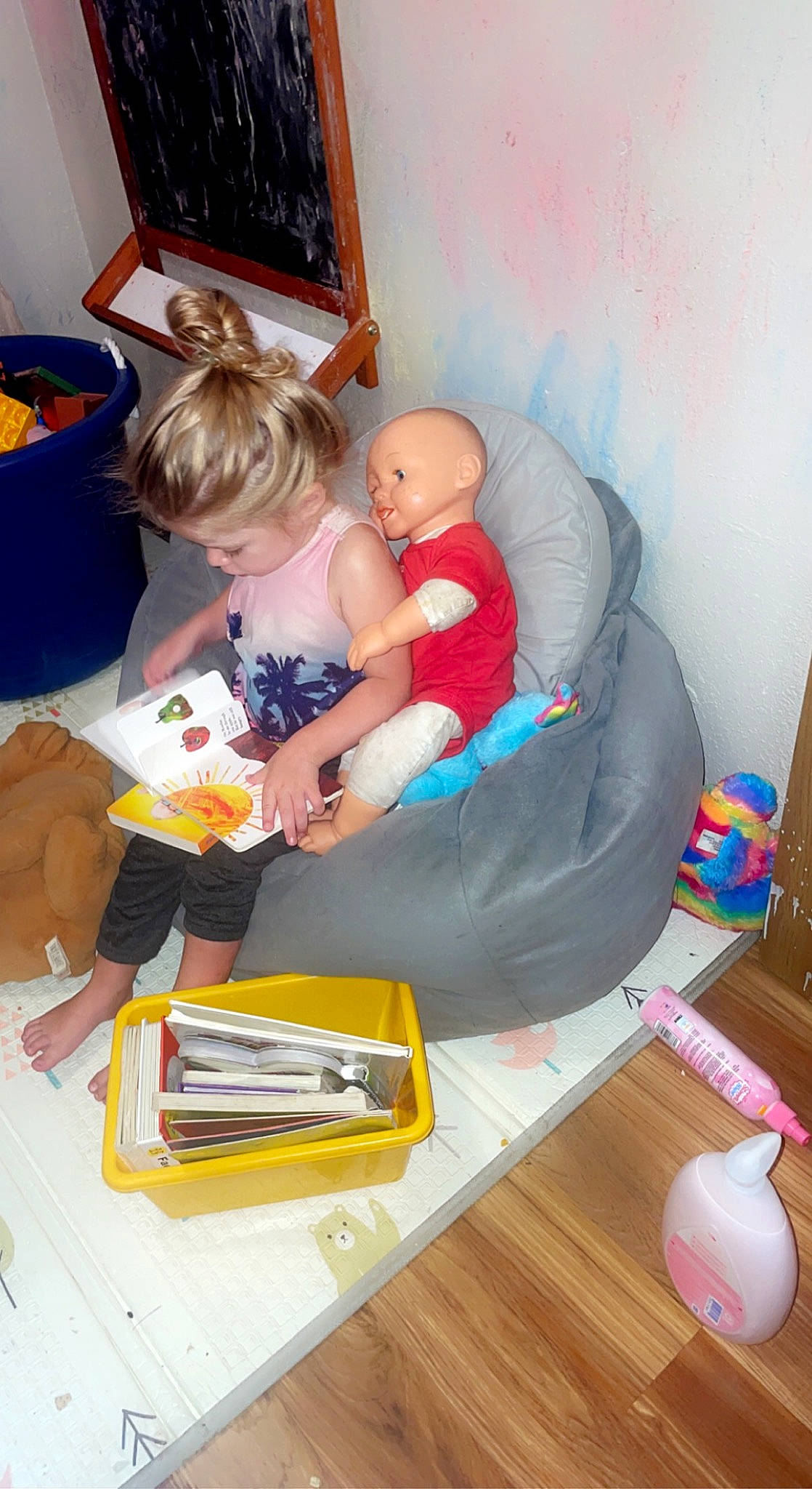 Sofia is registered to the contest to win money with this photo: baby, baby_products, baby_toys, child, comfort, couch, event, flooring, fun, hardwood, lap, leisure, living_room, person, play, room, sitting, television, thigh, toddler