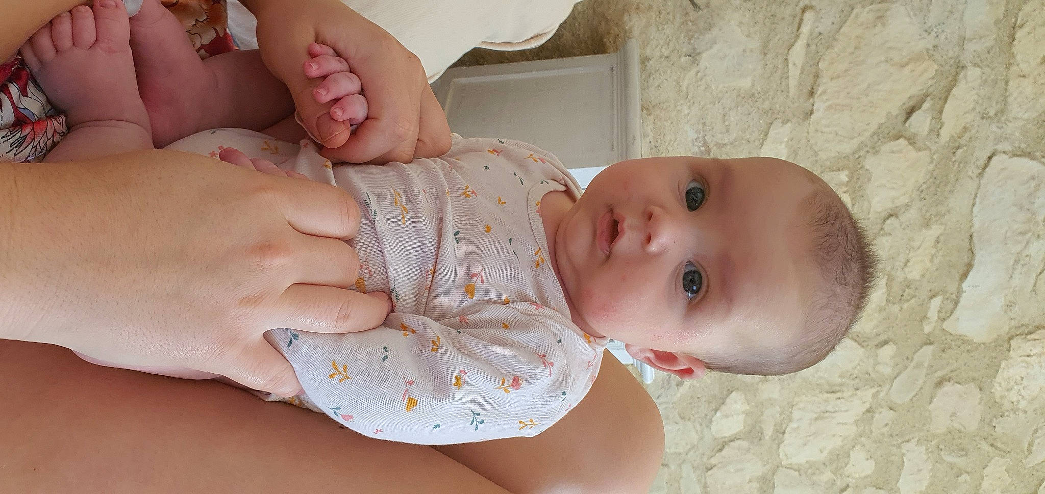 Baptiste participe au concours pour gagner de l'argent avec cette photo : arm, baby, baby_toddler_clothing, cheek, eye, face, facial_expression, finger, gesture, hand, head, human_body, lip, mouth, nose, organ, person, pink, skin, stomach