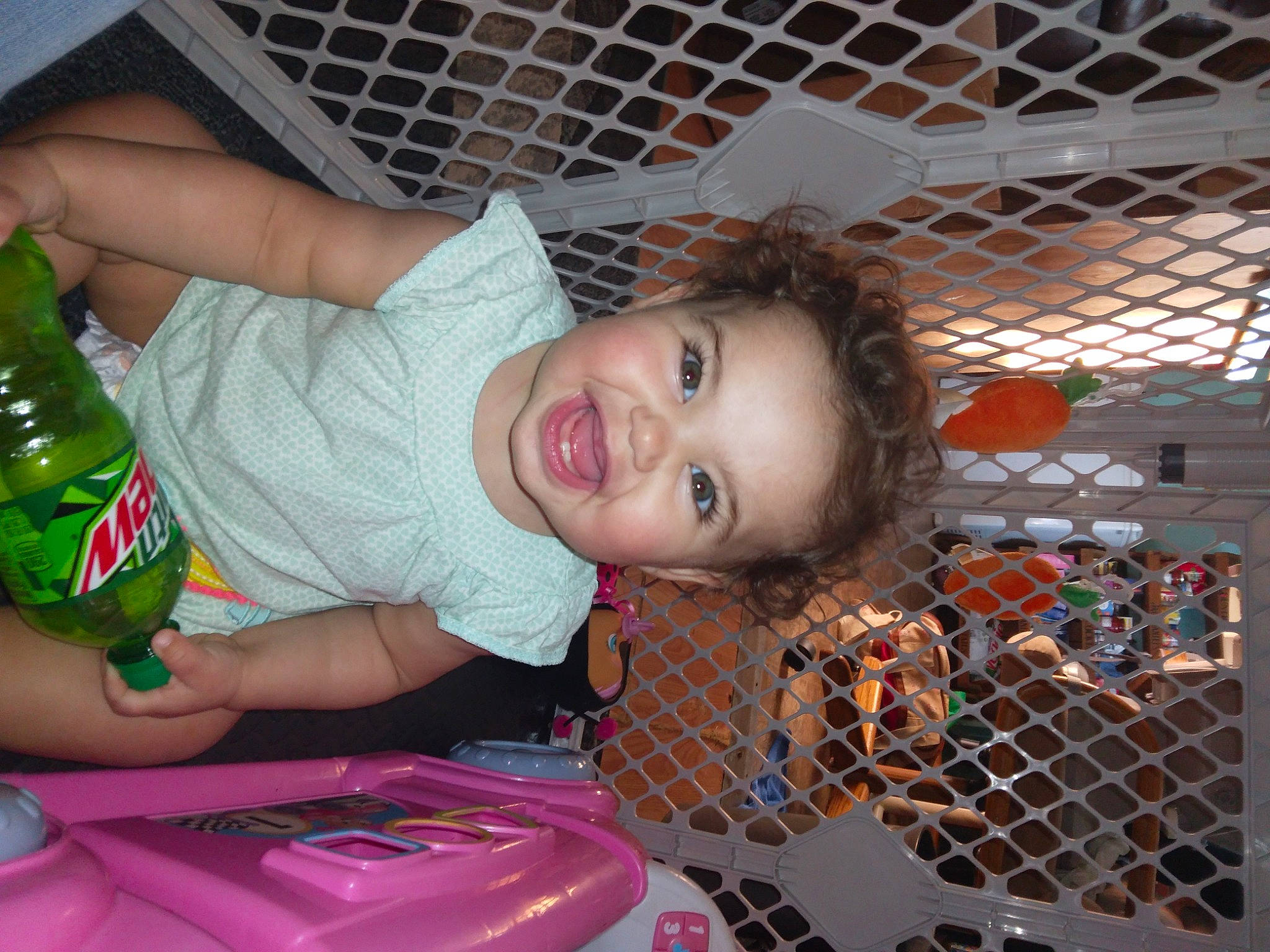 Braelynn is registered to the contest to win money with this photo: baby, baby_products, baby_toddler_clothing, bottle, child, drink, fun, glass_bottle, green, happy, leisure, mesh, mouth, nail, pattern, person, plastic_bottle, skin, smile, toddler