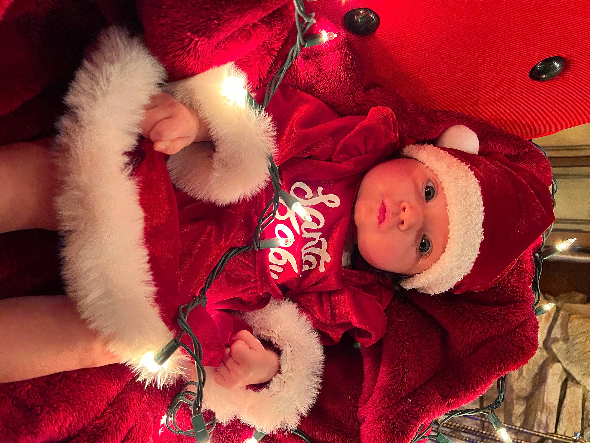 Lylah is registered to the contest to win money with this photo: baby, baby_toddler_clothing, child, comfort, costume_hat, event, head, headgear, headwear, human_body, lap, magenta, person, pink, plant, purple, red, stuffed_toy, textile, toddler