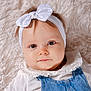 baby, child, headband, bow, denim, overalls, white_shirt, frilly_collar, fluffy_blanket, close_up, portrait, cute, infant, face, eyes, skin, hair, lying_down, indoors, soft_texture