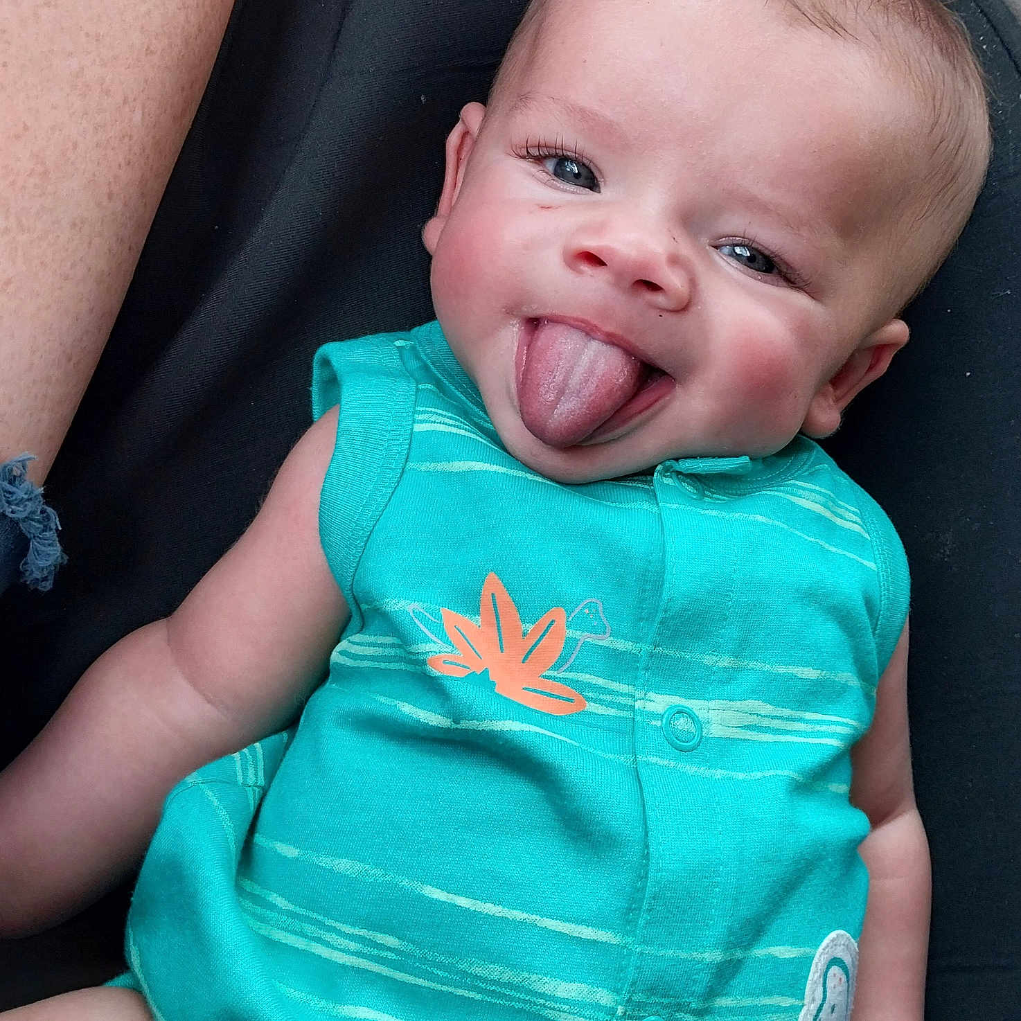 John is registered to the contest to win money with this photo: baby, bodypart, clothing, dress, face, happy, head, homedecor, laughing, mouth, newborn, pants, person, photography, portrait, selfie, smile, t_shirt, teeth, tongue