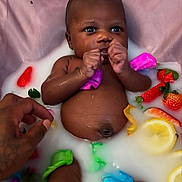 Xylia is registered to the contest to win money with this photo: baby, bath, child, closeup, colorful_petals, cute, fresh, fruit_slices, hand, healthy, infant, lemon, milky_bath, natural_light, peaceful, person, relaxation, skin, strawberries, water