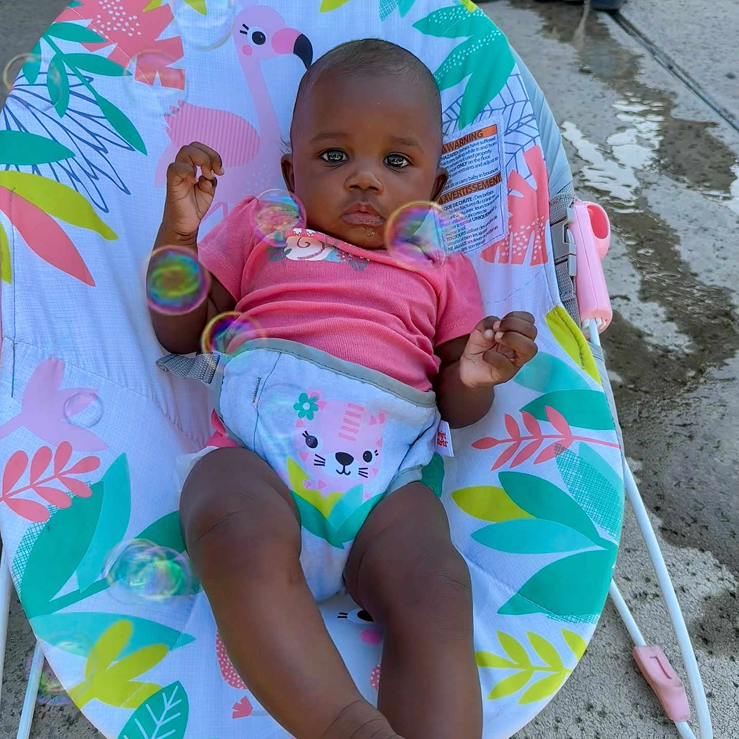 Xylia joined the competition — help win amazing prizes! baby, baby_seat, bubbles, child, colorful, concrete, cute, expression, grass, infant, legs, outdoor, pink_shirt, playful, portrait, relaxed, seat, shoes, summer, toddler