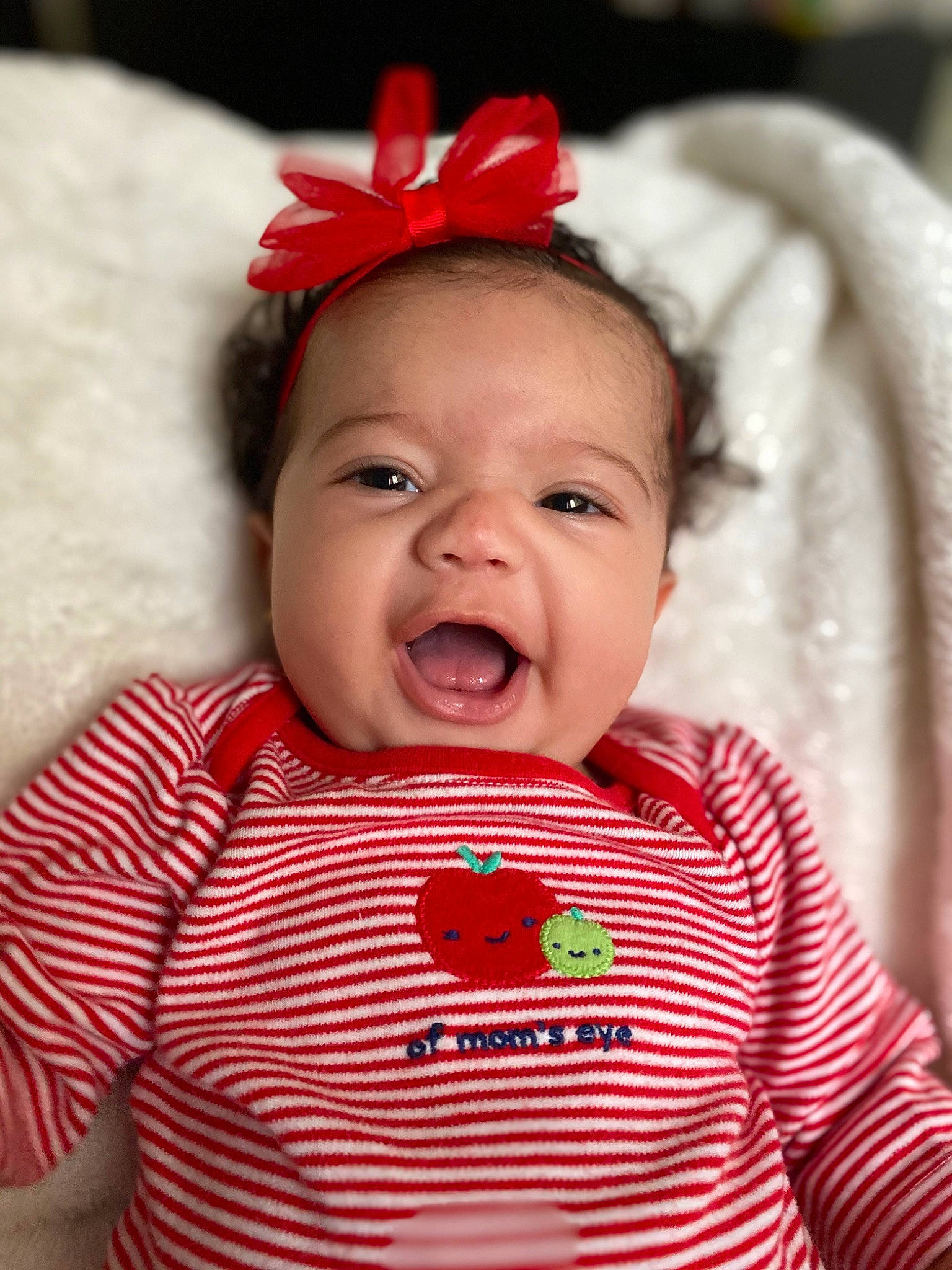 Khalia joined the competition — help win amazing prizes! baby, baby_laughing, cheek, child, chin, face, facial_expression, hair_accessory, happy, head, headgear, laugh, lip, nose, person, red, skin, smile, toddler