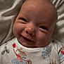 Emmie is registered to the contest to win money with this photo: baby, smiling, face, onesie, bunny_print, floral_print, infant, closeup, cute, happy, skin, head, sleepwear, portrait, child, newborn, soft_lighting, blanket, indoors, expression