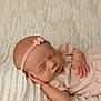 Emmie is registered to the contest to win money with this photo: newborn, baby, sleeping, headband, pink, bow, blanket, soft, texture, peaceful, cozy, infant, cute, resting, portrait, child, hands, face, skin, closeup