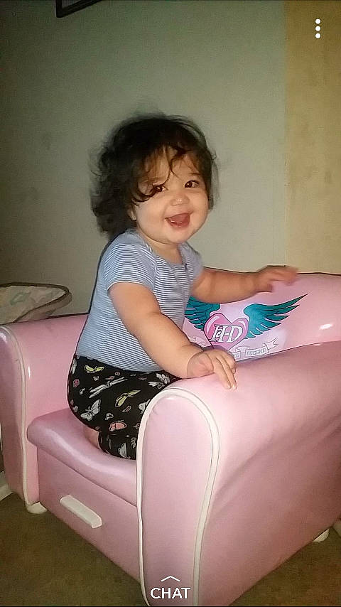 Murphy joined the competition — help win amazing prizes! arm, child, couch, day, finger, fun, furniture, girl, hand, hip, human_hair_color, joint, joy, leg, mouth, person, pink, shoulder, sitting, thigh