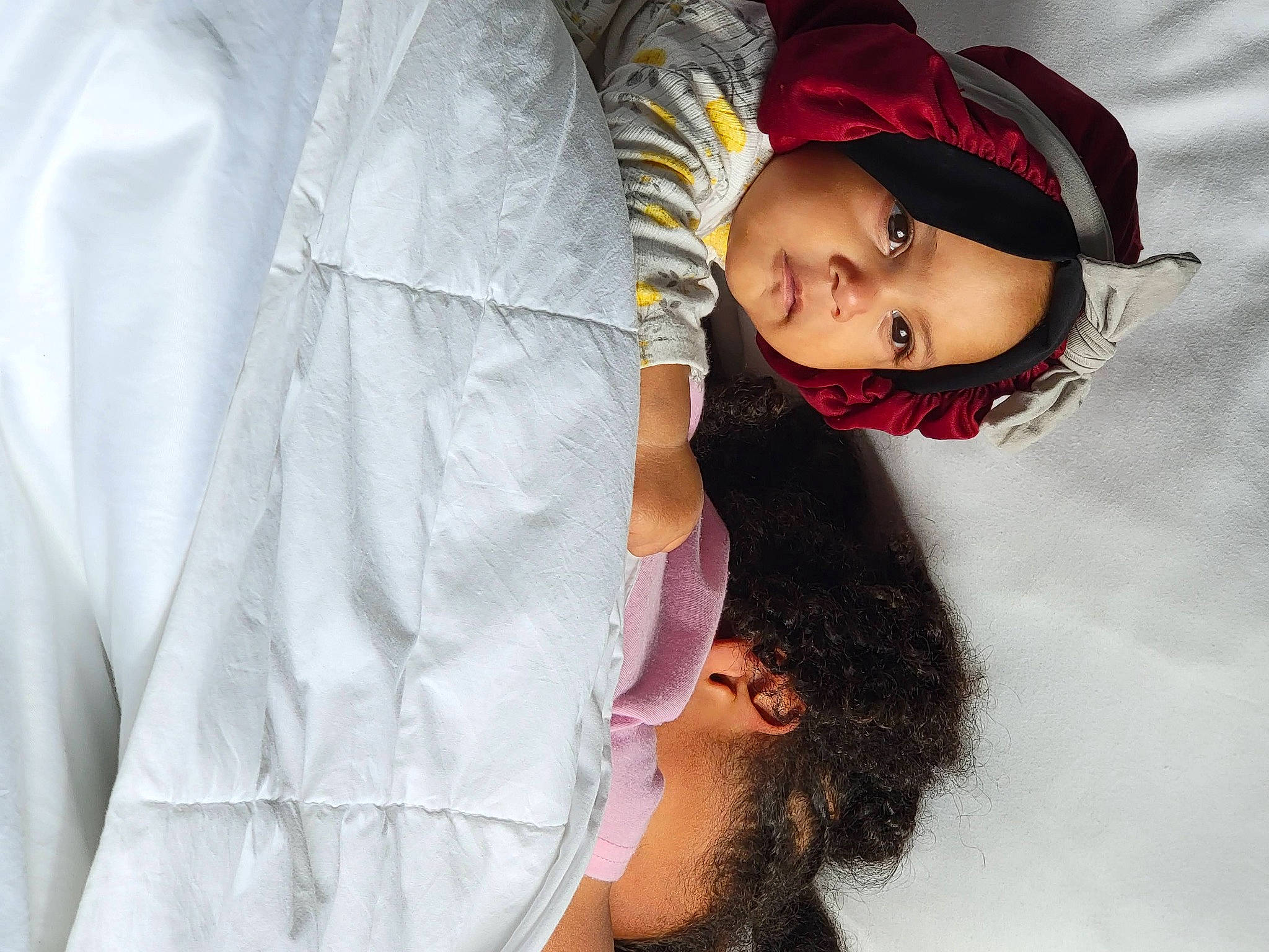 Athena is registered to the contest to win money with this photo: arm, baby, cap, child, comfort, flash_photography, fun, gesture, hand, happy, headgear, headwear, human_body, lip, mouth, nose, person, portrait_photography, skin, sleeve