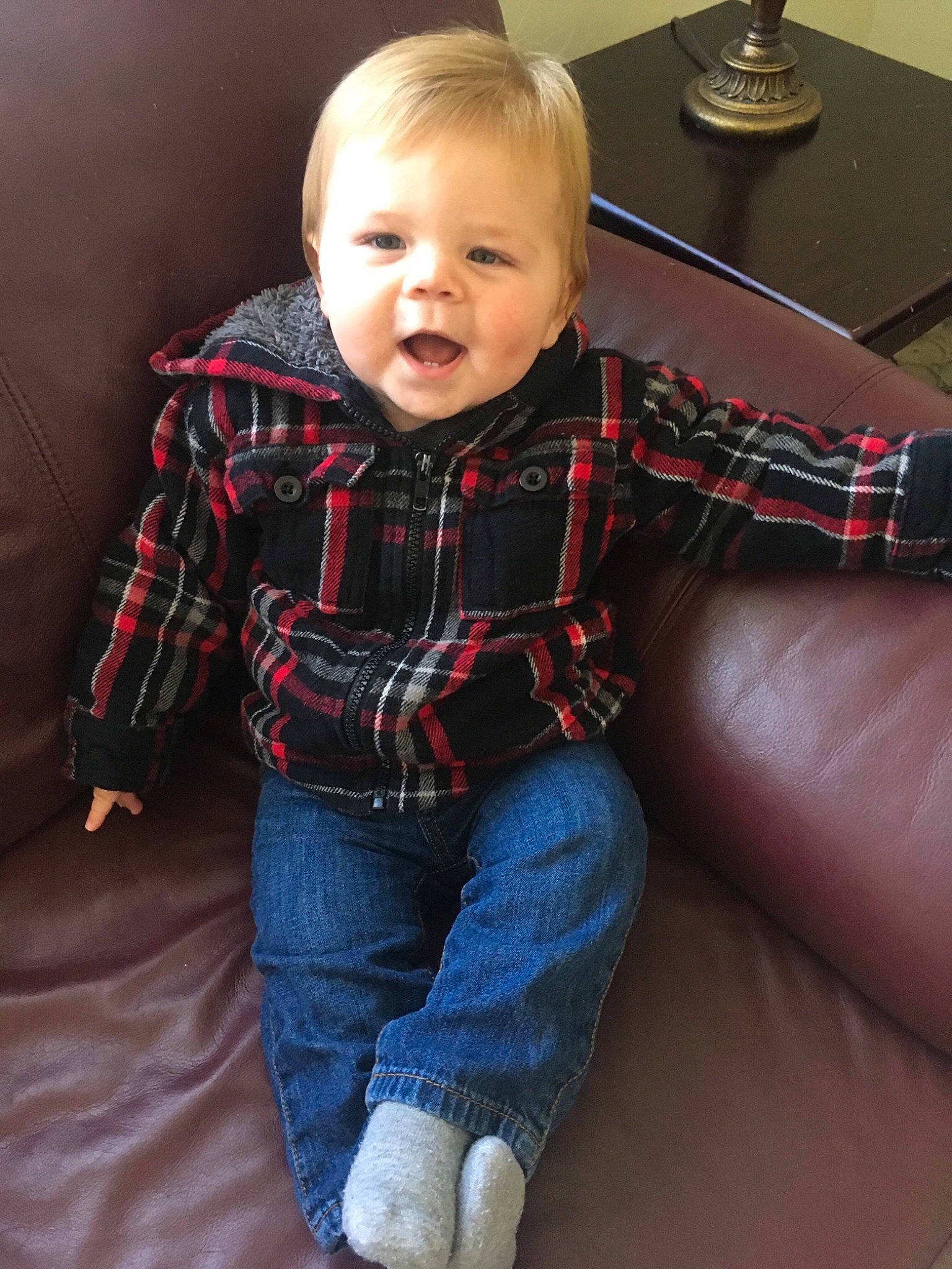Karson is registered to the contest to win money with this photo: baby, cheek, child, child_model, design, jeans, pattern, person, plaid, sitting, sleeve, standing, tartan, textile, toddler