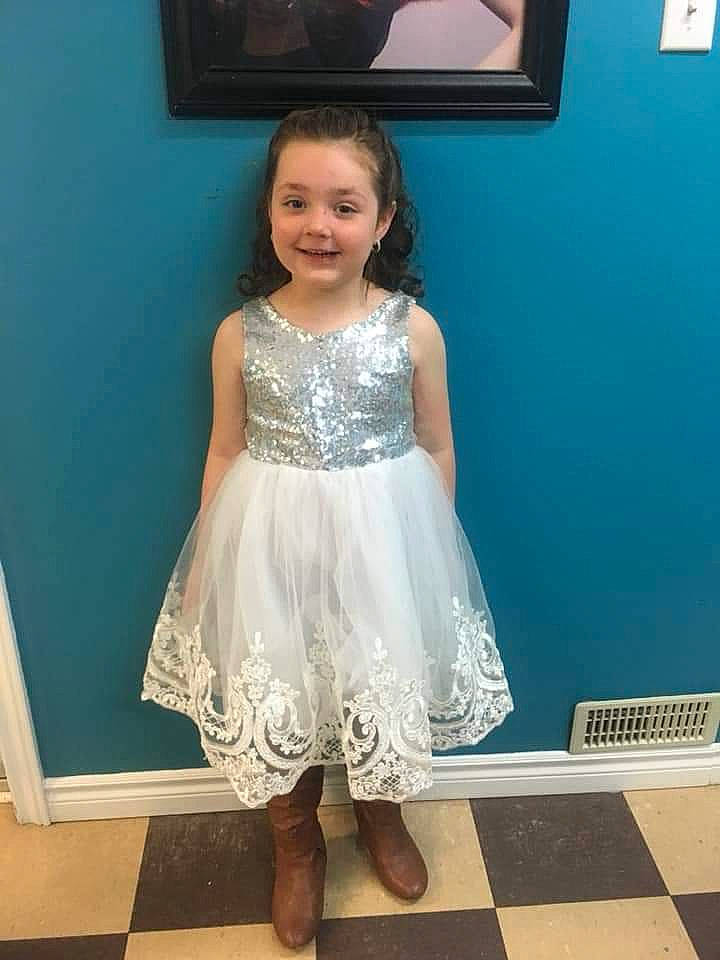 Kiley is registered to the contest to win money with this photo: a_line, blue, bridal_party_dress, child, child_model, clothing, cocktail_dress, costume, dress, fashion_design, footwear, formal_wear, joy, person, shoe, shoulder, toddler, white