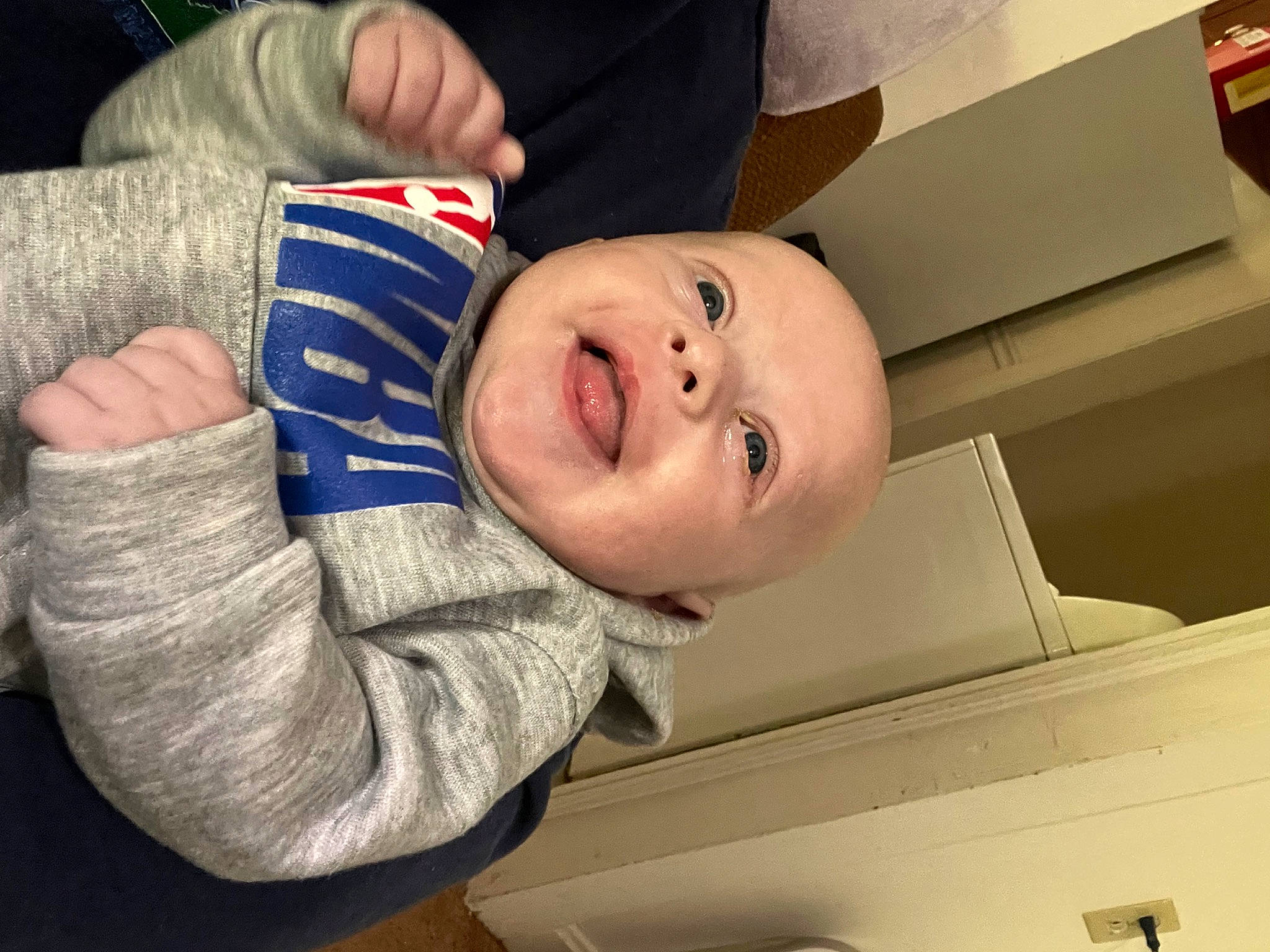 Malaki is registered to the contest to win money with this photo: baby, baby_laughing, baby_toddler_clothing, cheek, child, comfort, electric_blue, finger, fun, gesture, hand, happy, laugh, mouth, nose, person, room, sleeve, smile, thumb