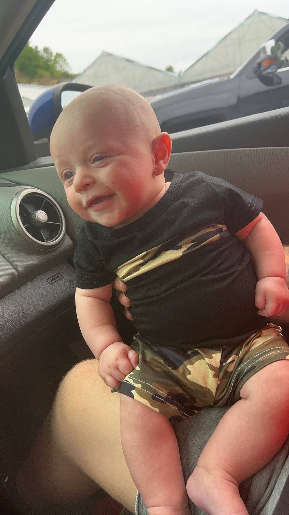 Malaki is registered to the contest to win money with this photo: auto_part, automotive_design, automotive_exterior, automotive_tire, baby_toddler_clothing, car, car_seat, child, finger, human_leg, knee, motor_vehicle, person, personal_luxury_car, shorts, skin, steering_wheel, thigh, thumb, toddler