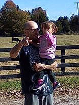 Izzy Nicole is registered to the contest to win money with this photo: arm, baby, child, fence, fun, gesture, grass, grassland, happy, landscape, leisure, people_in_nature, person, plant, play, recreation, sky, soil, toddler, travel