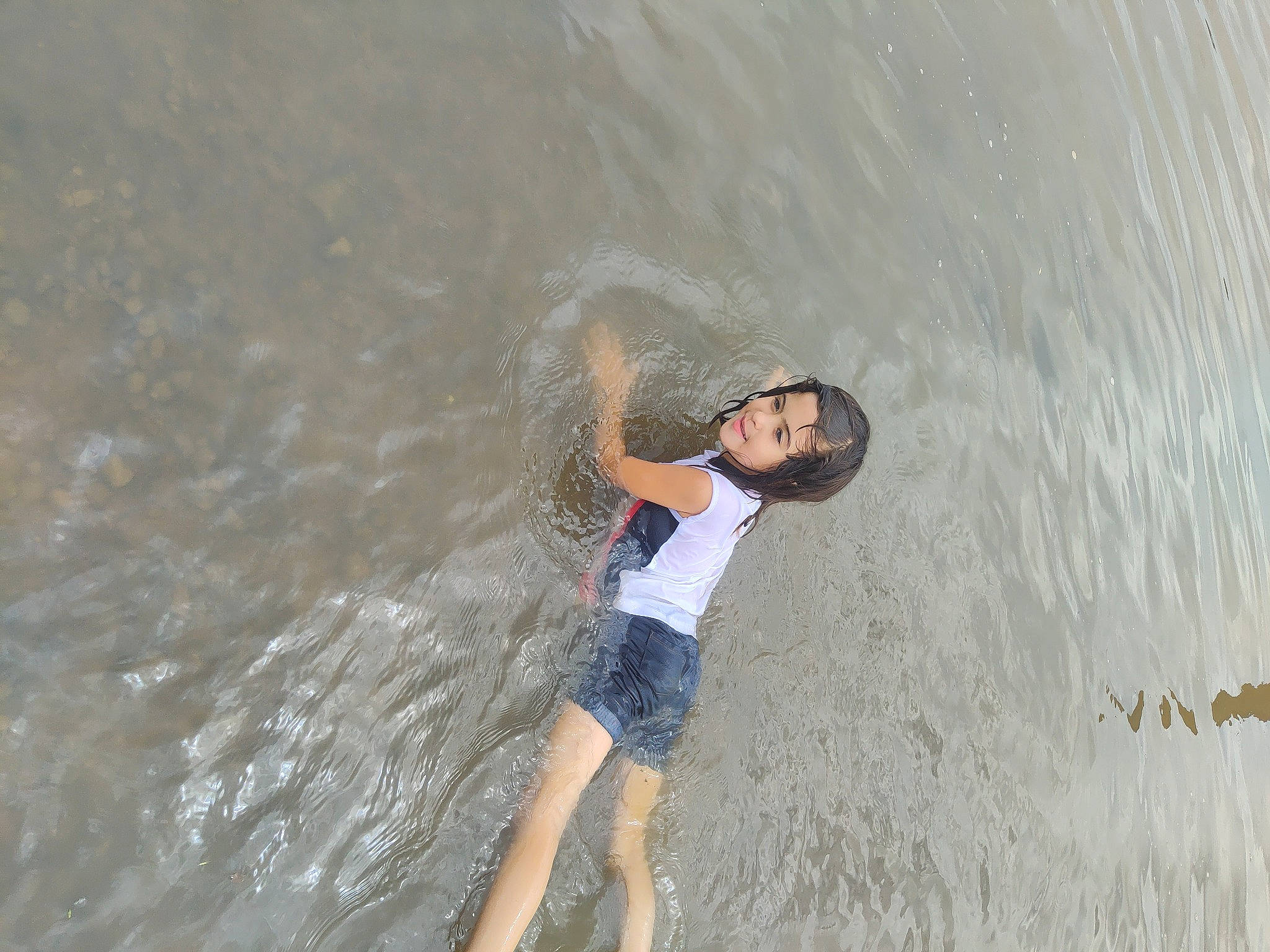 Izzy is registered to the contest to win money with this photo: barefoot, beach, flash_photography, fun, glasses, happy, human_leg, lake, landscape, leisure, people_in_nature, person, recreation, sand, shorts, sunglasses, t_shirt, tree, water, wave