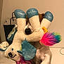 animal, brown, claw, colorful, cute, dog, fabric, fun, furry, home, indoor, nose, paw, pet, playful, plush, stuffed_animal, toy, unicorn, white