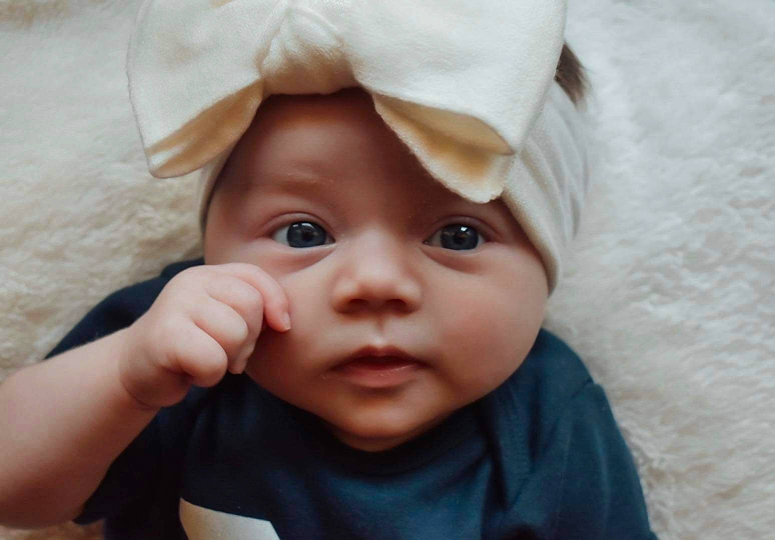 Nova joined the competition — help win amazing prizes! baby, baby_toddler_clothing, cheek, child, close_up, comfort, eyebrow, eyelash, gesture, happy, hat, headwear, linens, lip, no_expression, nose, person, portrait_photography, skin, sleeve