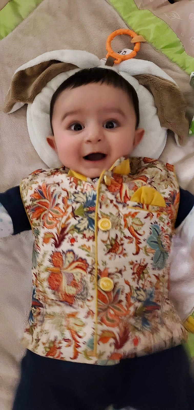 Mustafa is registered to the contest to win money with this photo: baby, child, outerwear, pattern, person, sleeve, toddler