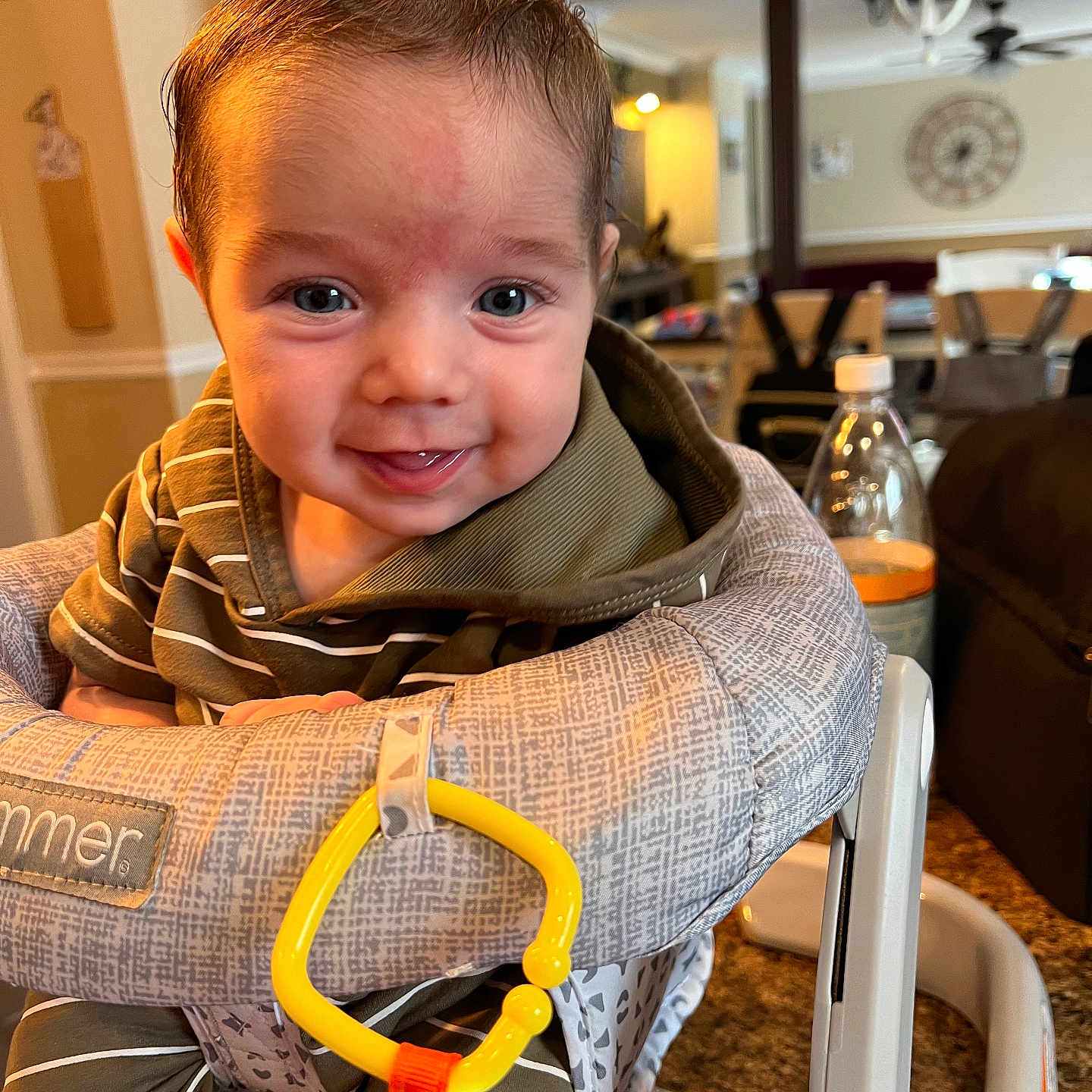 Atlas is registered to the contest to win money with this photo: accessories, baby, bodypart, chair, clothing, coat, couch, face, finger, furniture, hand, head, homedecor, lifejacket, pants, person, photography, portrait, strap, vest