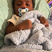Ahzai joined the competition — help win amazing prizes! baby, bed, blanket, child, clothing, comfort, curly_hair, furniture, hand, indoors, infant, lying_down, pacifier, person, portrait, resting, sleepwear, soft_texture, toddler, young_child