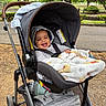 Zaedyn joined the competition — help win amazing prizes! baby, stroller, blanket, hoodie, smile, child, outdoor, park, trees, happy, person, seatbelt, infant, wheel, pathway, greenery, daylight, nature, casual, relaxed