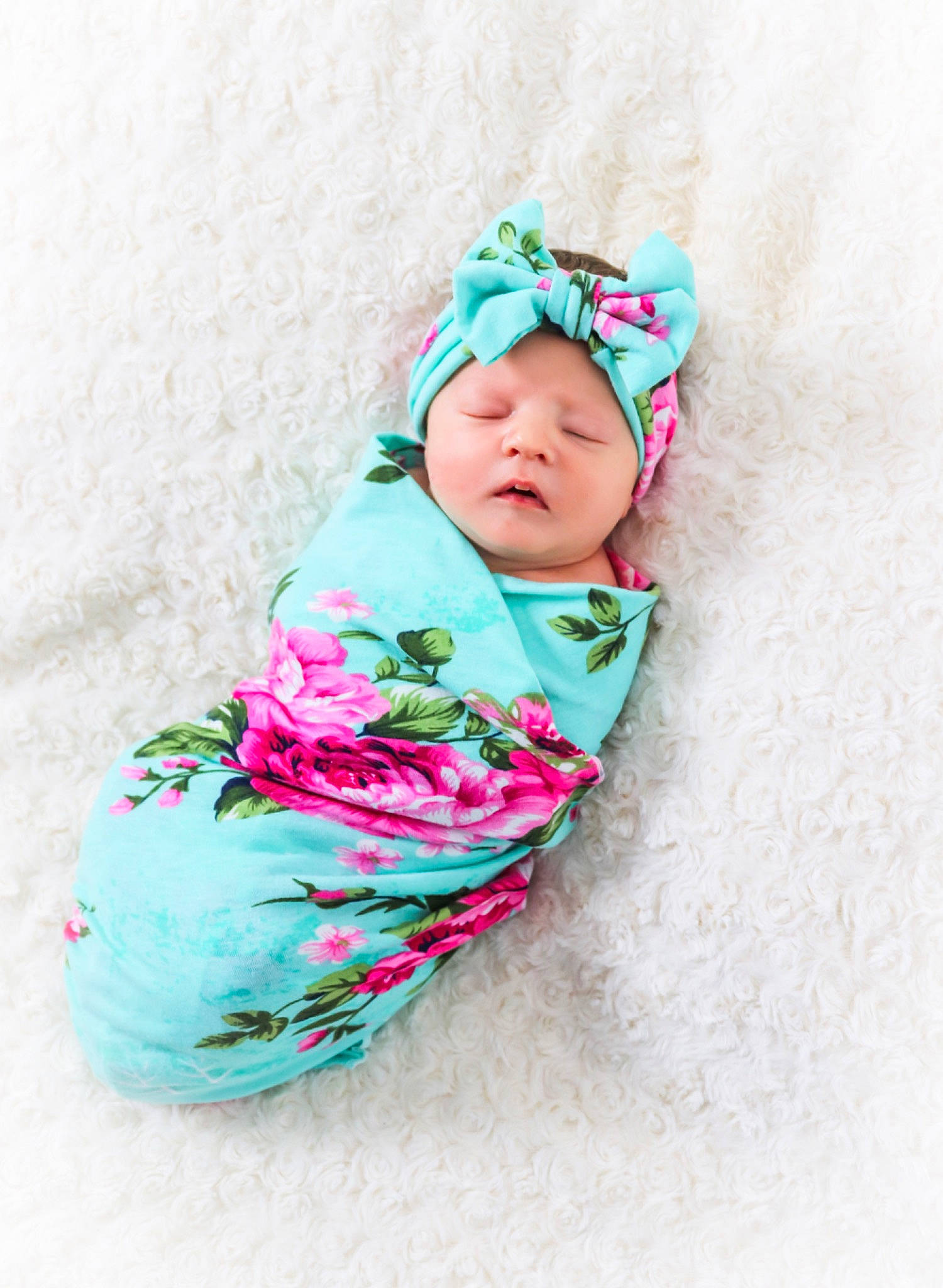 Oakleigh is registered to the contest to win money with this photo: baby, baby_products, baby_toddler_clothing, child, fashion_accessory, hair_accessory, headgear, pattern, person, pink, product, smile, textile, toddler, turquoise