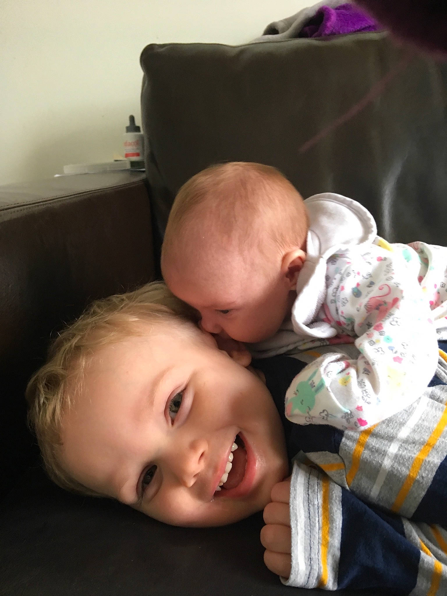 Alfie Bryan Ford is registered to the contest to win money with this photo: baby, cheek, child, family, fun, head, mother, nose, people, person, room, sibling, sitting, skin, smile, toddler