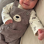 Martin participe au concours pour gagner de l'argent avec cette photo : baby, smiling, corduroy, overalls, bear_face, infant, cute, child, happy, clothing, reaching_hand, lying_down, soft_surface, portrait, indoors, person, toddler, apparel, face, cute_outfit