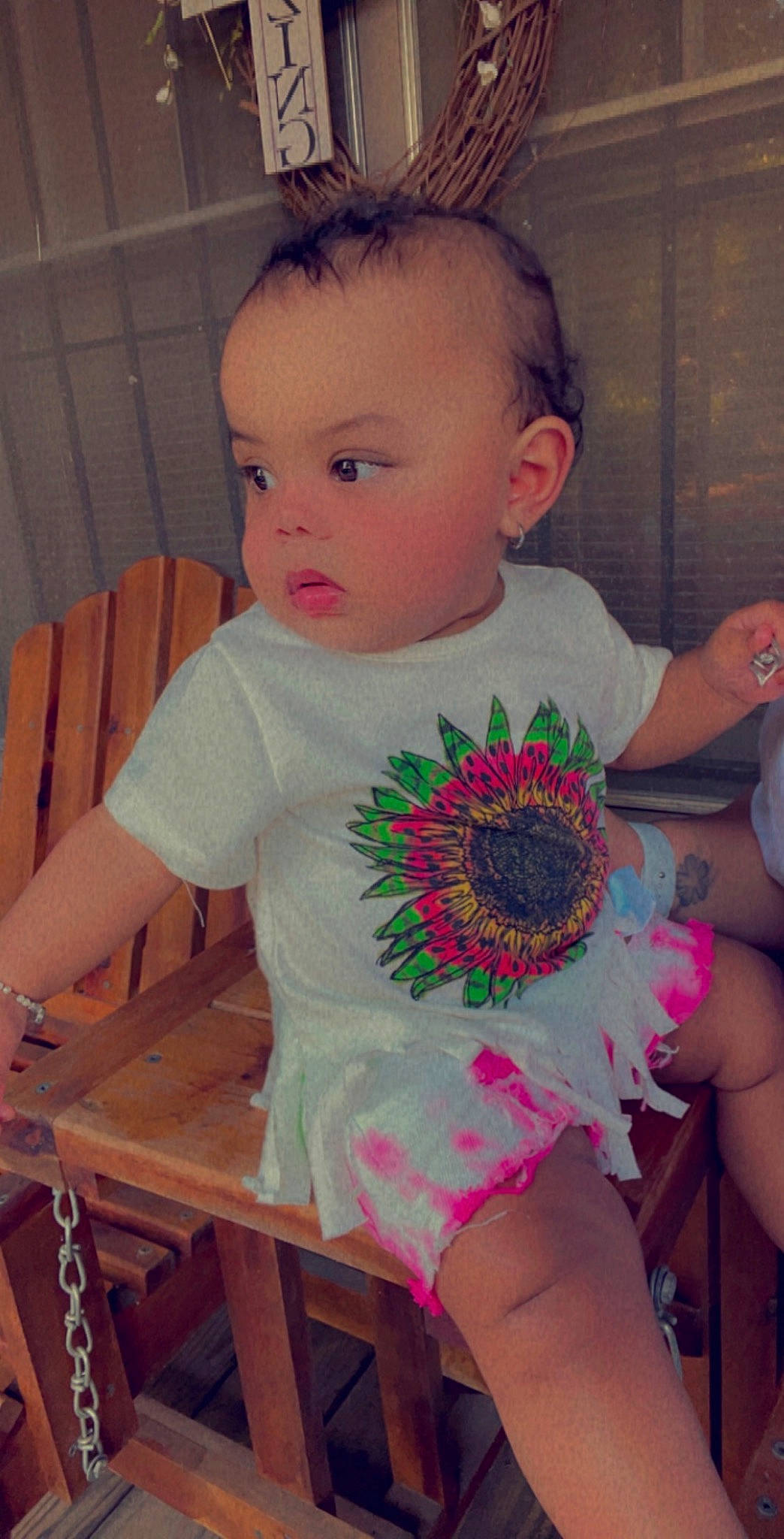 Nylah joined the competition — help win amazing prizes! arm, baby, baby_toddler_clothing, chair, child, finger, flower, furniture, happy, iris, person, petal, pink, plant, shoulder, sitting, skin, table, thigh, toddler