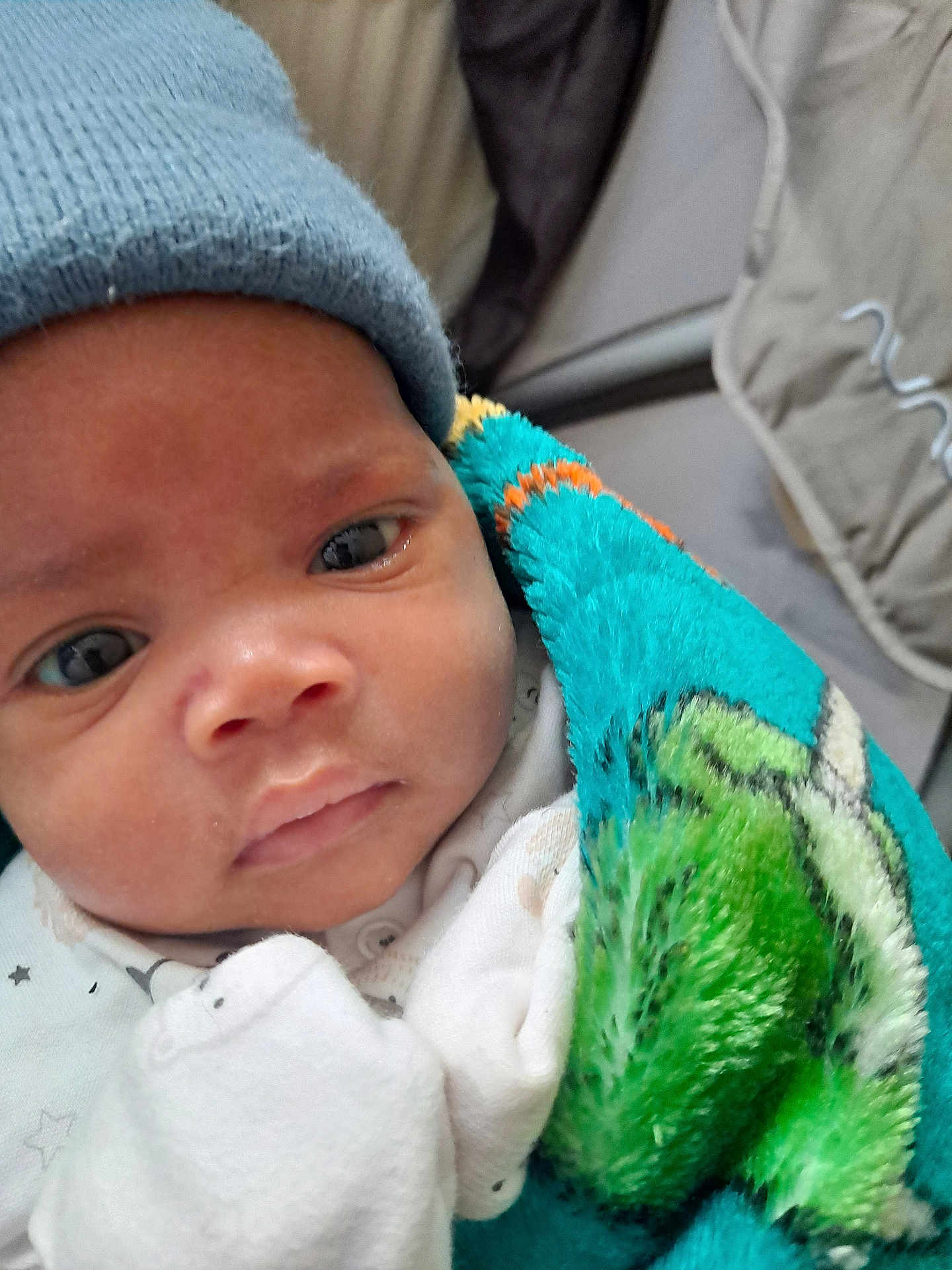 Ace joined the competition — help win amazing prizes! baby, beanie, blanket, bonnet, cap, clothing, coat, face, glove, hat, head, hood, jacket, knitwear, newborn, person, photography, portrait, sleeping, towel