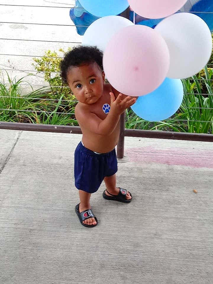 Mateo joined the competition — help win amazing prizes! balloon, child, electric_blue, event, flip_flops, fun, grass, happy, leisure, magenta, party_supply, person, plant, play, recreation, sandal, shorts, slipper, t_shirt, toddler