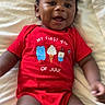 baby, infant, smiling, red_onesie, clothing, laying_down, blanket, cute, happy, portrait, child, indoors, skin, face, arms, legs, expression, celebration, holiday, summer