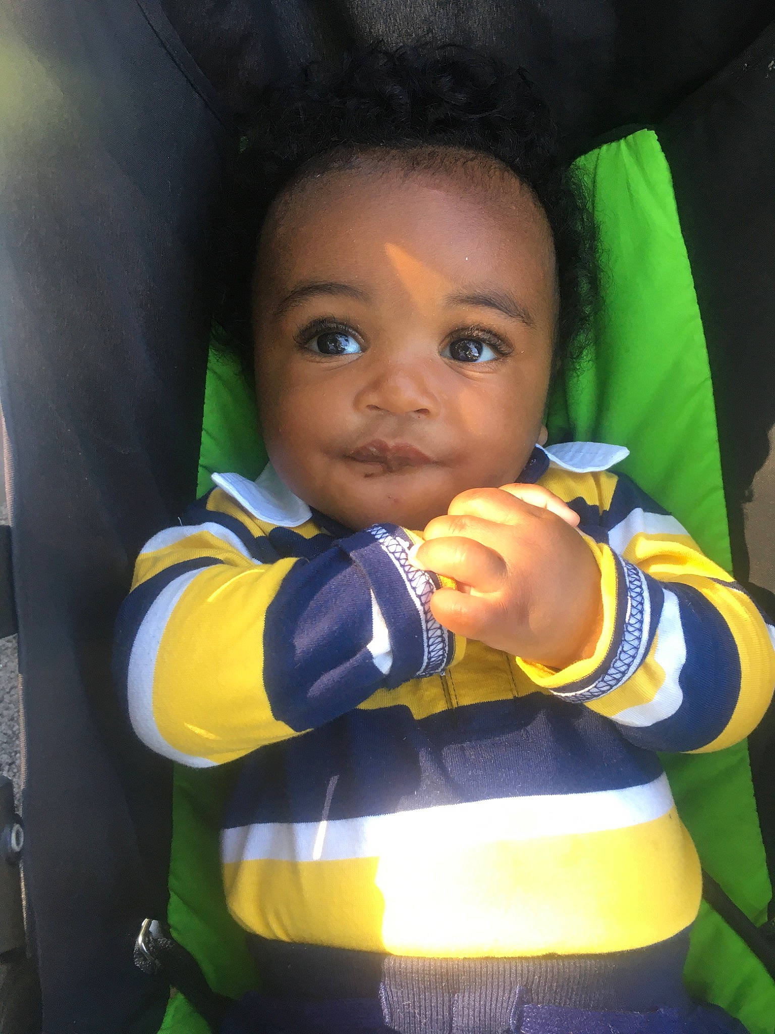 Israel is registered to the contest to win money with this photo: baby, baby_products, child, competition_event, electric_blue, eye, fun, happy, leisure, nose, person, personal_protective_equipment, player, recreation, selfie, sitting, sleeve, t_shirt, toddler, uniform