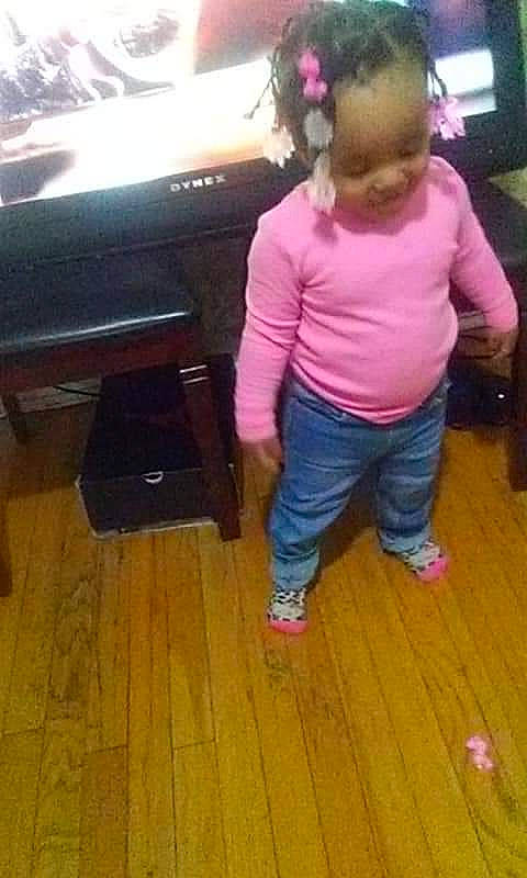 Kenslee Ja'Maiya joined the competition — help win amazing prizes! baby, child, electronic_device, finger, floor, flooring, footwear, fun, hardwood, leg, magenta, person, pink, play, room, standing, technology, thumb, toddler, wood