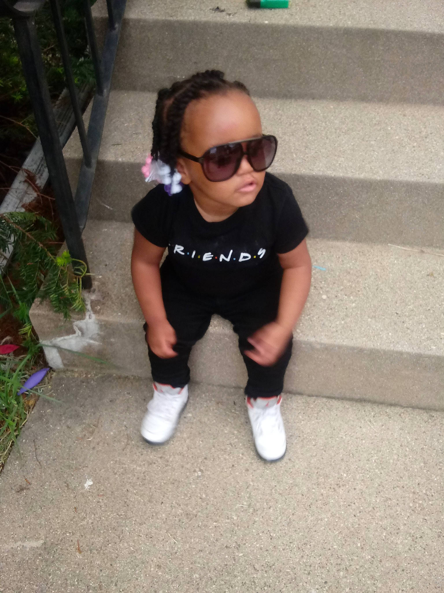 Kenslee Ja'Maiya is registered to the contest to win money with this photo: child, cool, eyewear, footwear, glasses, knee, leg, nose, person, plant, shoe, smile, sportswear, sunglasses, t_shirt, toddler, vacation, vision_care