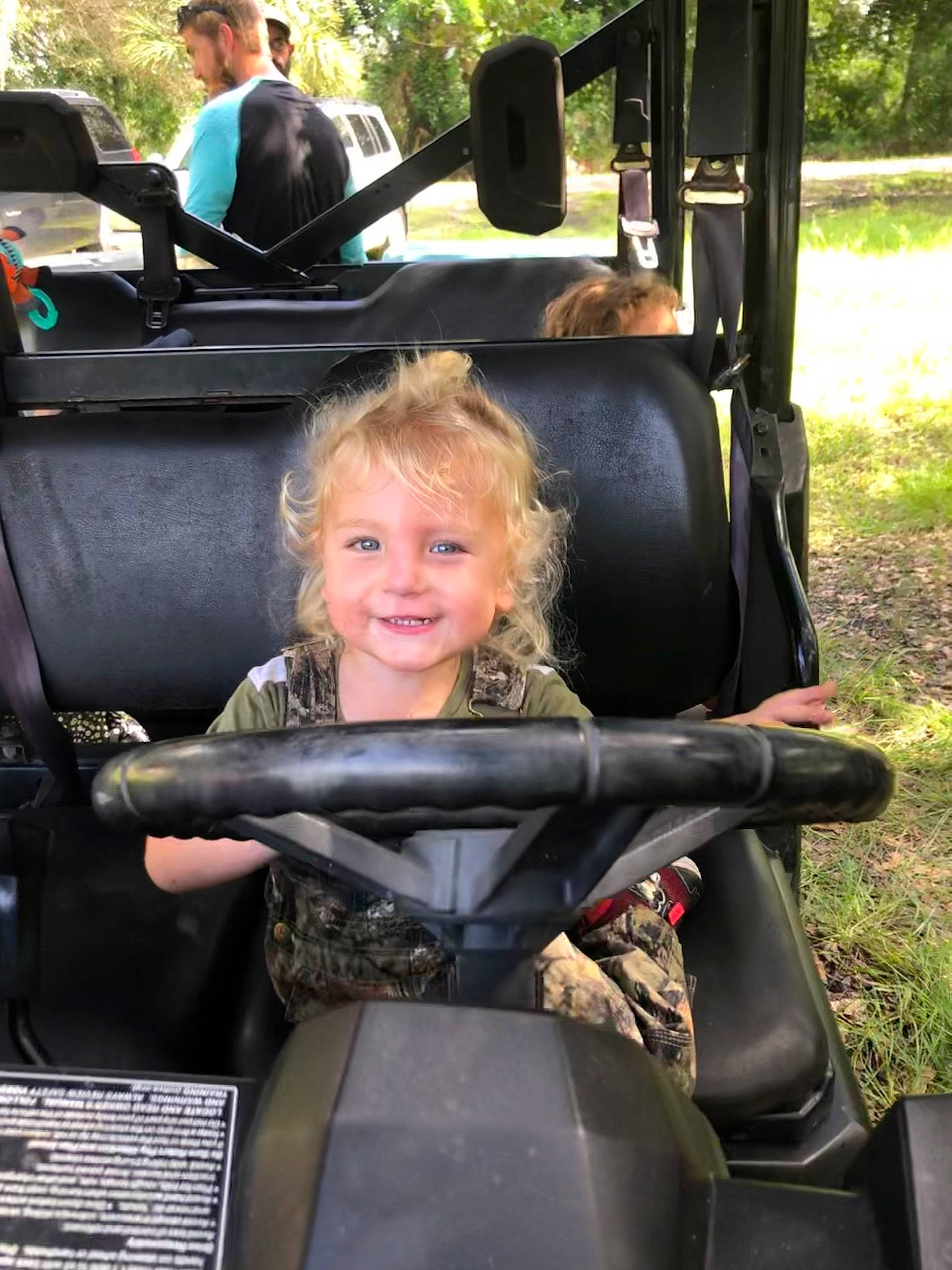 Jax is registered to the contest to win money with this photo: auto_part, automotive_design, automotive_exterior, automotive_tire, bumper, classic, family_car, fun, hairstyle, joy, leisure, luxury_vehicle, motor_vehicle, person, plant, product, sitting, smile, toddler, travel