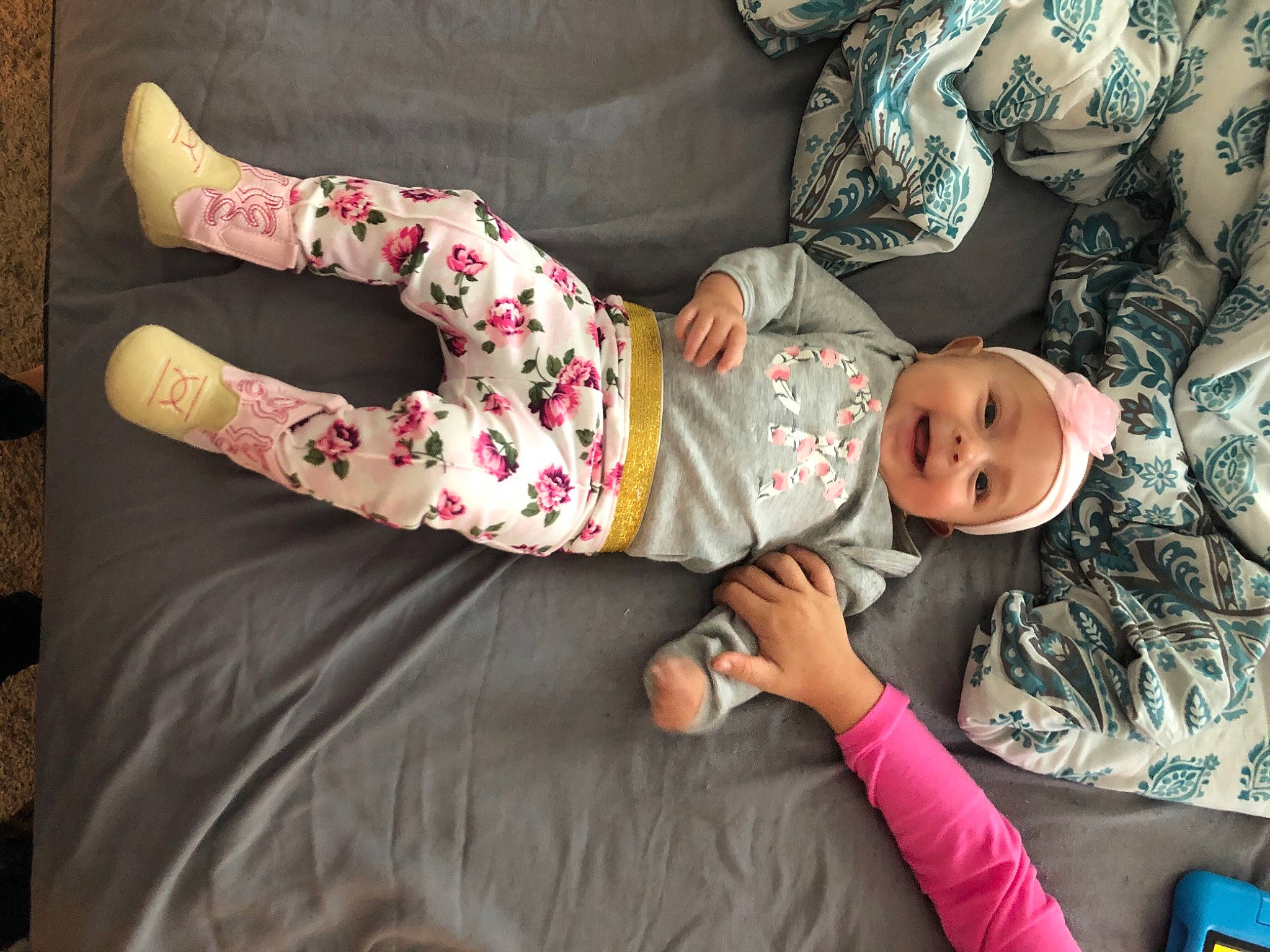 Adella joined the competition — help win amazing prizes! arm, baby, baby_toddler_clothing, comfort, couch, dress, finger, hand, headwear, human_body, human_leg, joy, leg, linens, pattern, person, pink, skin, sleeve, t_shirt