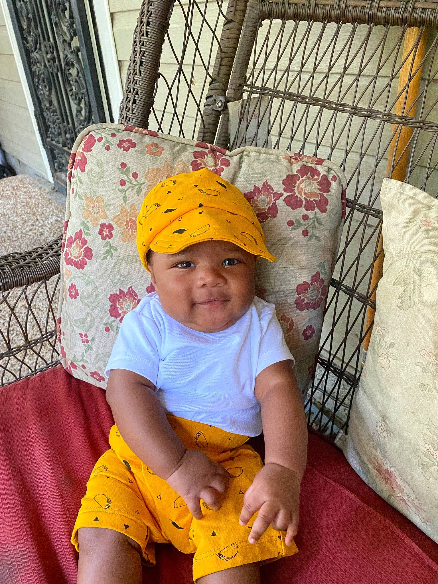 Tommie is registered to the contest to win money with this photo: baby, baby_toddler_clothing, baseball_cap, cap, child, comfort, fashion_accessory, fun, happy, hat, headgear, headwear, leisure, pattern, person, photograph, shorts, sleeve, smile, t_shirt