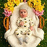 baby, infant, basket, knitted_blanket, flowers, yellow_flowers, pink_flowers, grass, outdoor, sushi_pajamas, hat, cute, portrait, child, nature, greenery, cozy, wicker, sitting, person
