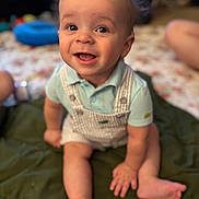 Malikai is registered to the contest to win money with this photo: baby, child, smile, happy, sitting, face, eyes, hair, clothing, pale_skin, indoor, blanket, legs, hands, cute, infant, portrait, toddler, expression, person