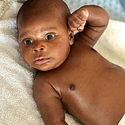 Eliot Dika Uwagwu is registered to the contest to win money with this photo: baby, bathing, bodypart, face, finger, hand, happy, head, neck, newborn, person, photography, portrait, shoulder, skin, smile